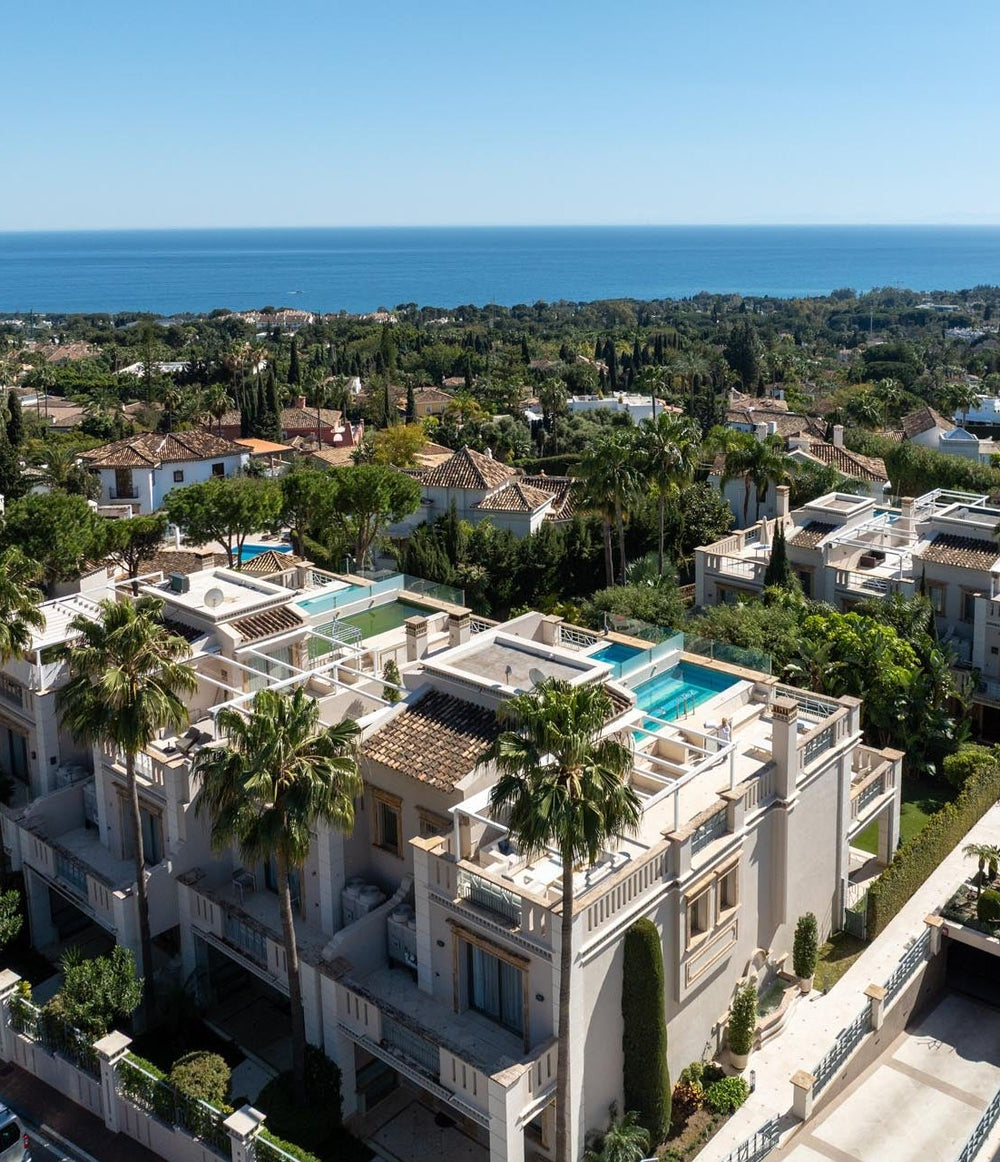 Aerial view over Sierra Blanca villas towards the sea, Marbella