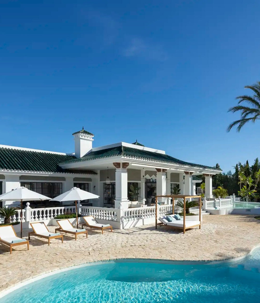 Villa Alhambra with pool and palm trees in Nueva Andalucía, Marbella