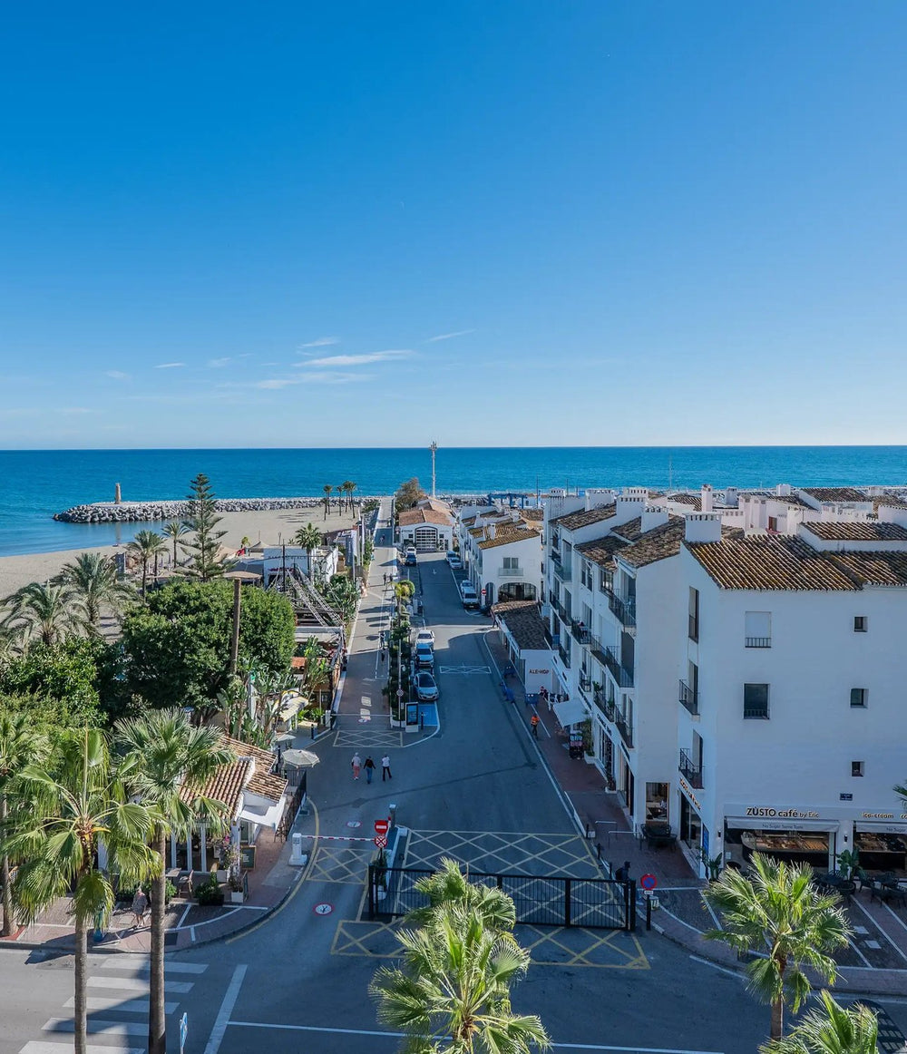 Aerial view of Puerto Banús beach, promenade and seafront apartments, Marbella