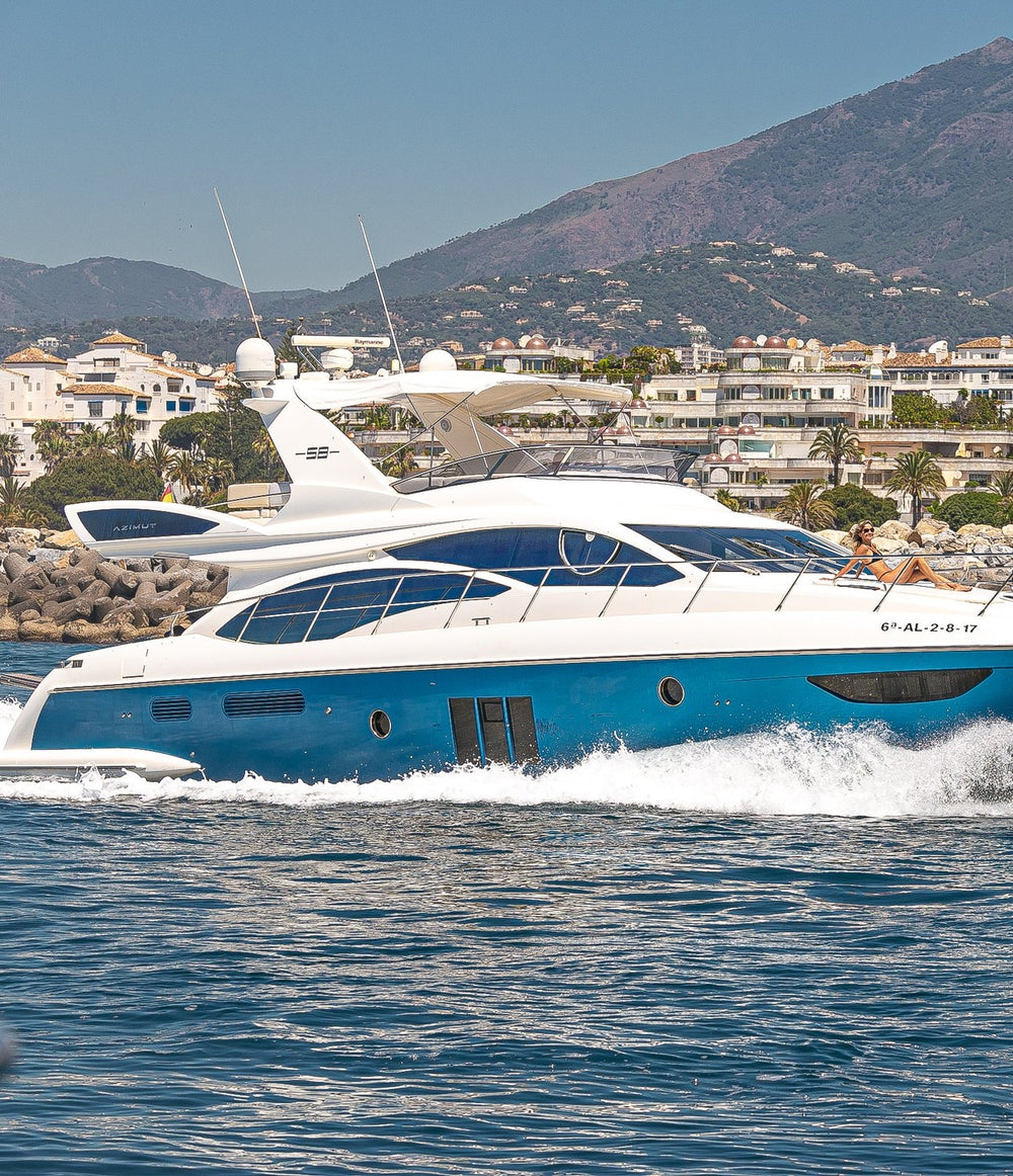 Azimut 58 motor yacht cruising off Marbella with La Concha mountain behind
