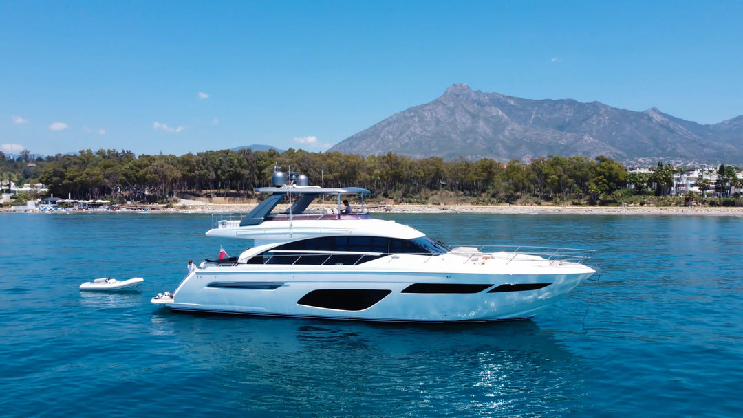 Princess F70 yacht cruising off Marbella, aerial view